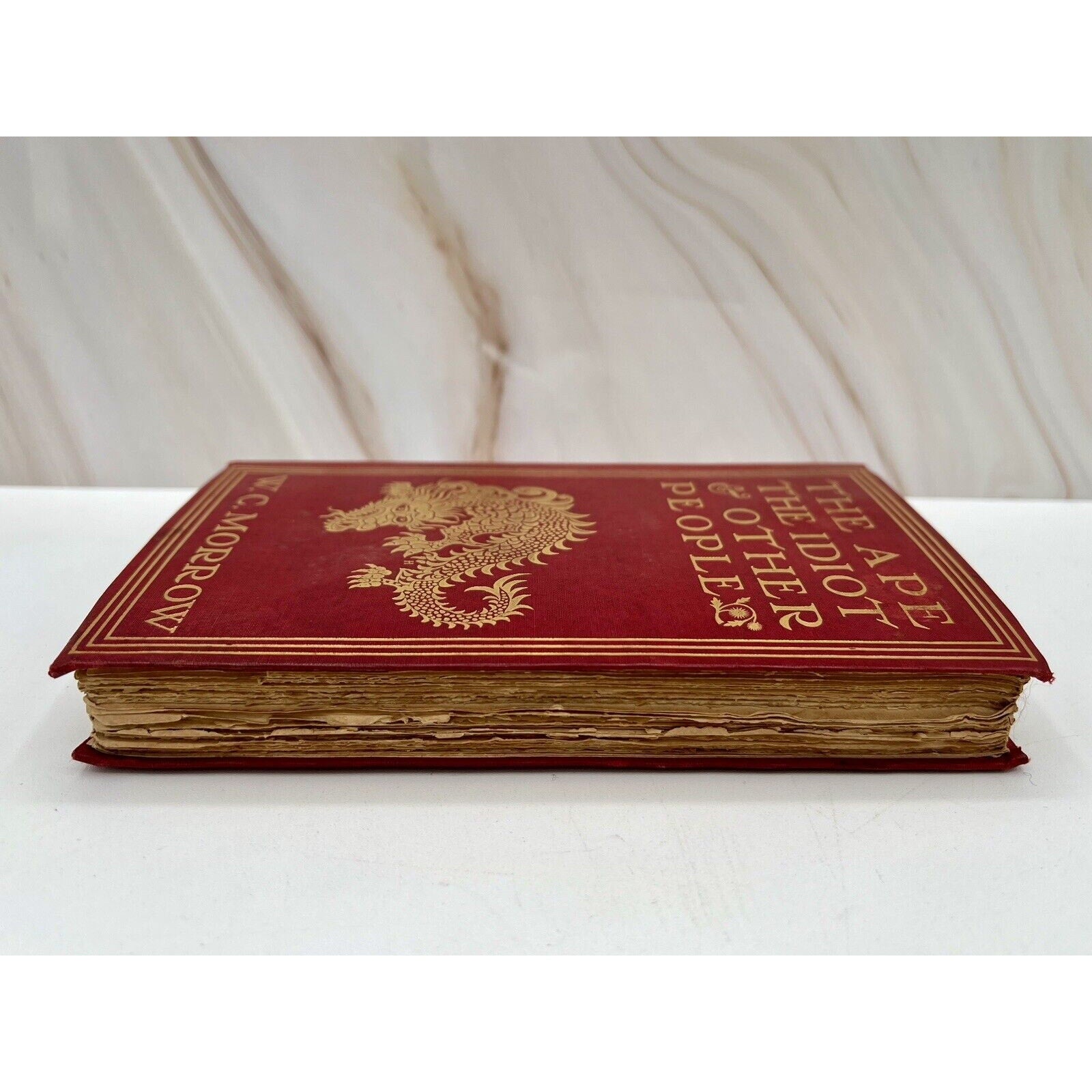 First edition red hardcover of The Ape, The Idiot & Other People (1897) by W.C. Morrow, J.B. Lippincott dragon motif