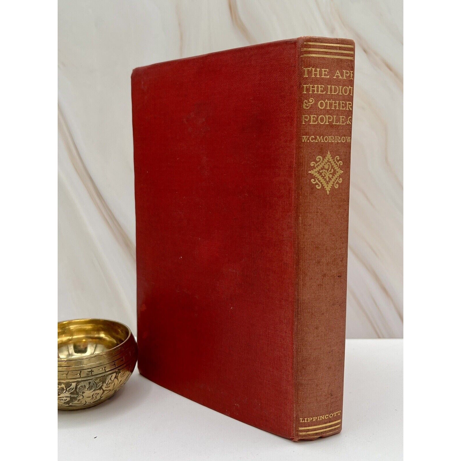 Red cloth-bound first edition of The Ape, The Idiot & Other People by W.C. Morrow (1897, Lippincott) Gothic horror.