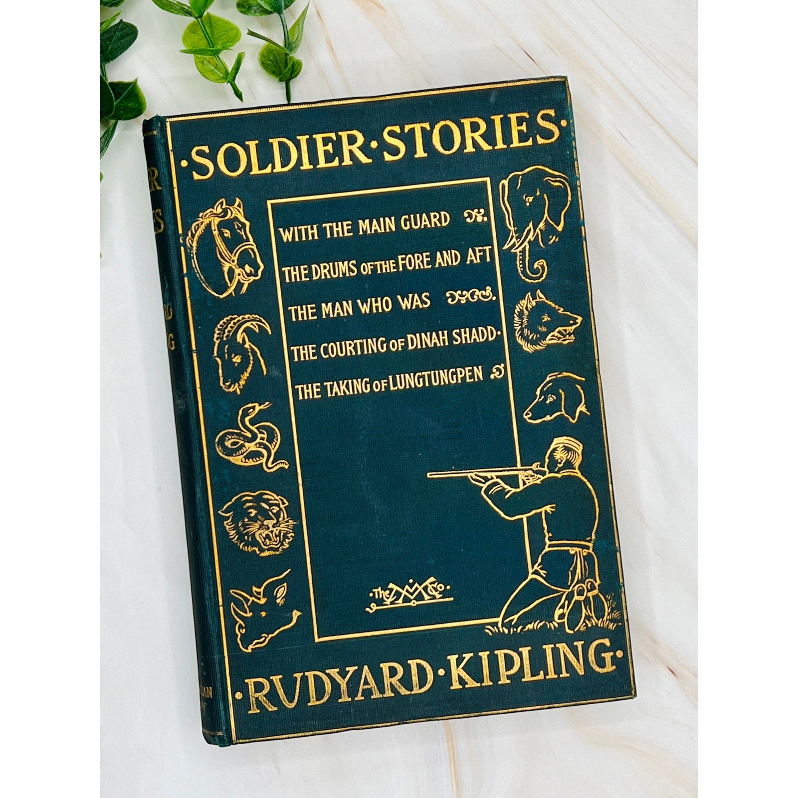 Antique Kipling Soldier Stories (1897) hardcover with gilt-stamped cover showing soldiers and exotic wildlife.